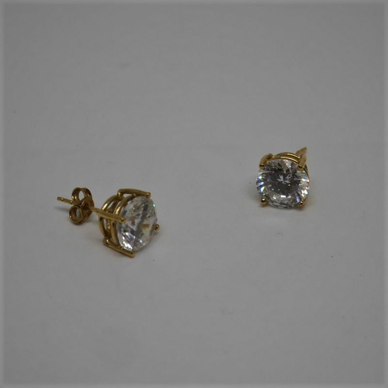 alt=\"pendientes garras oro niña mujer con circonita\"