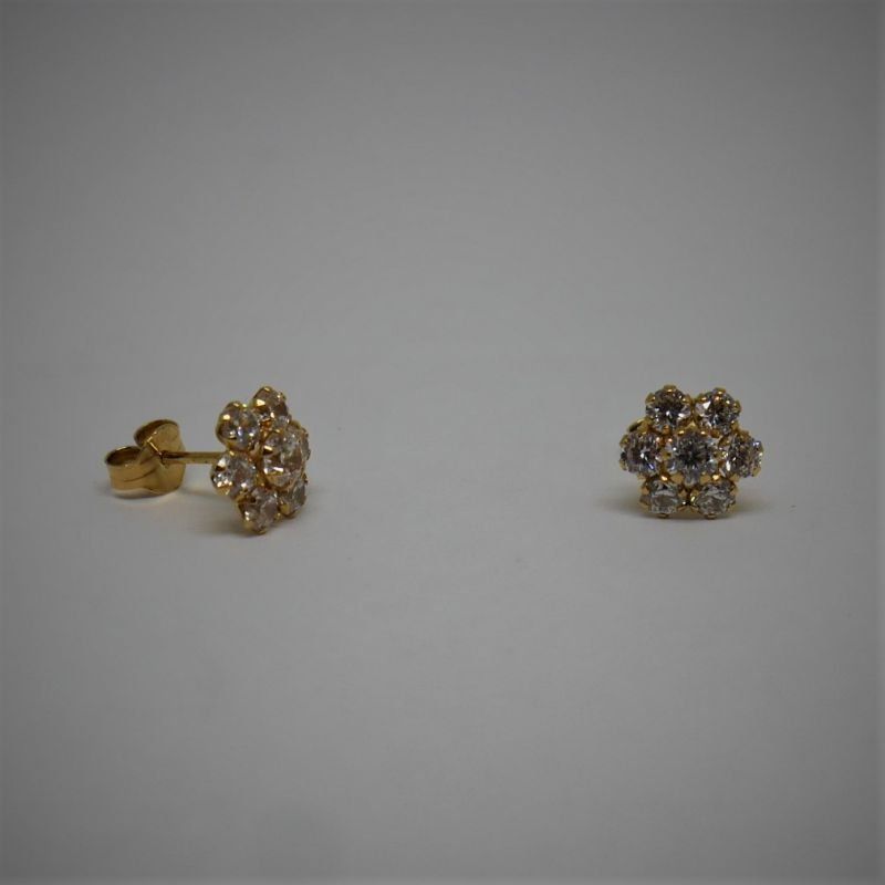 alt="pendientes de oro con circonitas para niña o mujer flor"