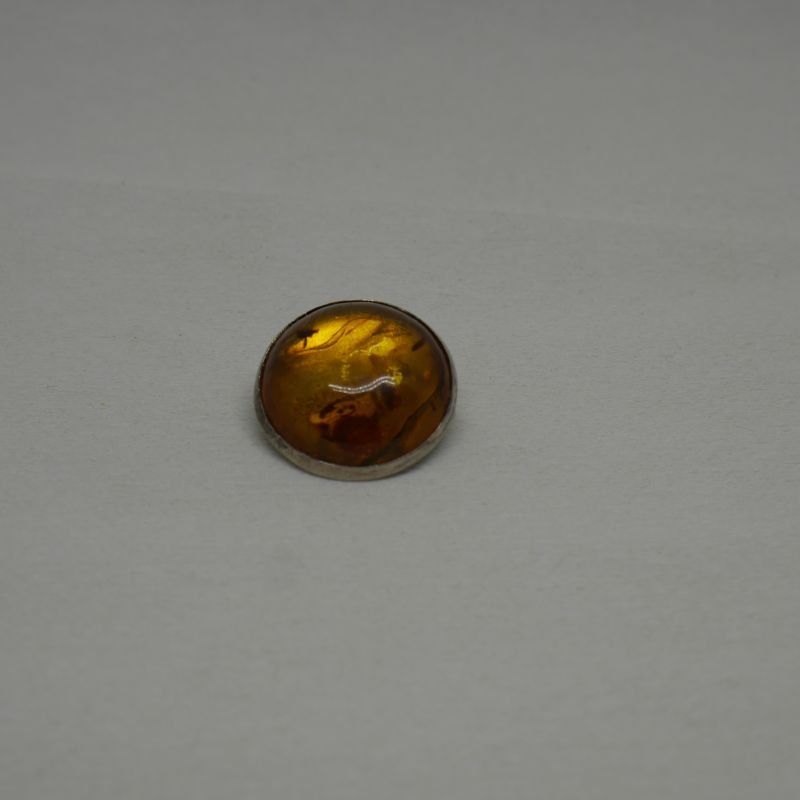 alt="broche de plata de ley y ambar redondo"