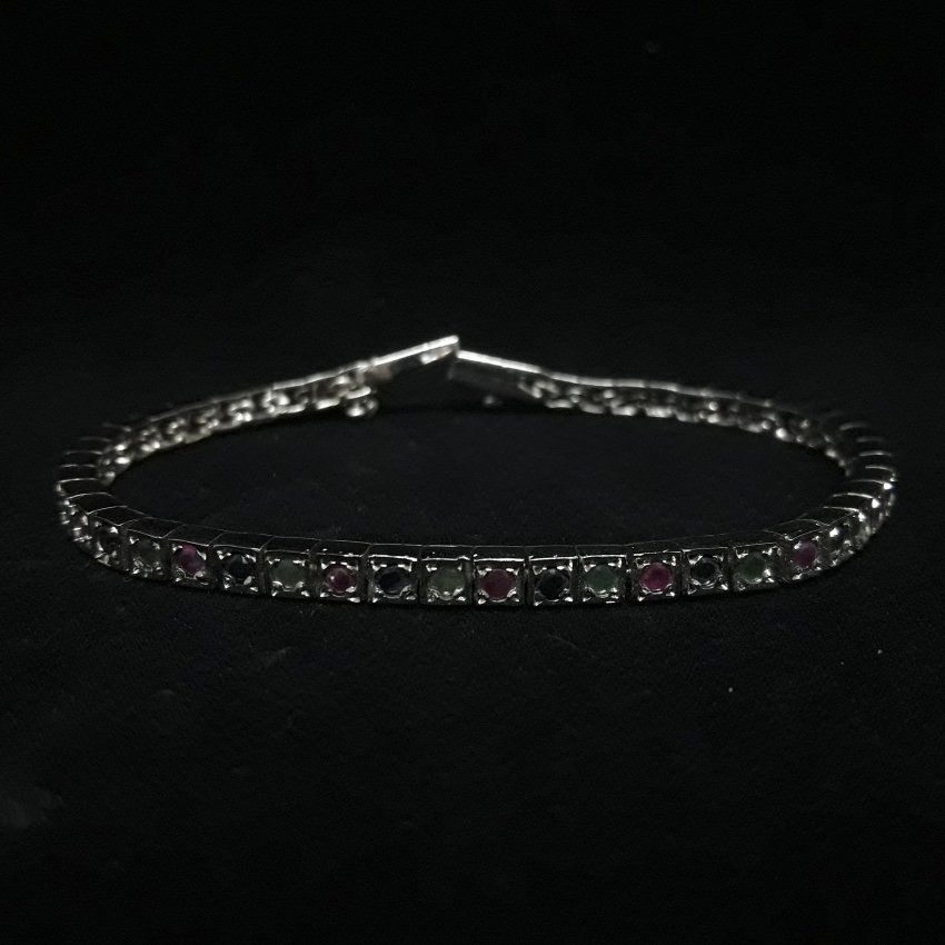 Pulsera de Plata de Ley con baño de rodio y sin fin de rubies, zafiros y esmeraldas