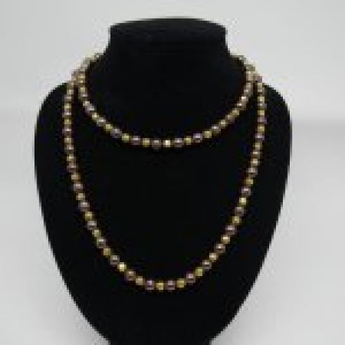 alt="Collar de Perlas cultivadas grises con cuentas y cierre de Oro de ley 18 K."