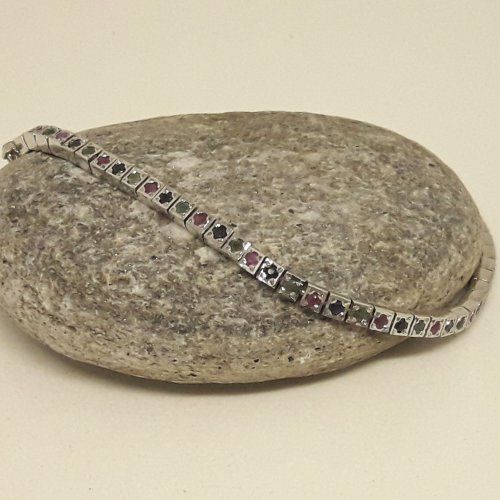 Pulsera de Plata de Ley, 925 Mils. con baño de rodio y sin fin de rubies, zafiros y esmeraldas