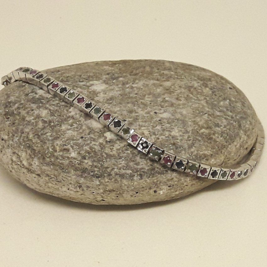 Pulsera de Plata de Ley, 925 Mils. con baño de rodio y sin fin de rubies, zafiros y esmeraldas
