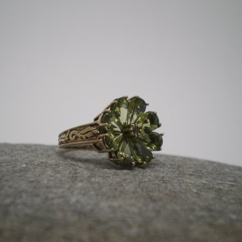 alt=\"Sortija oro olivinas flor\"