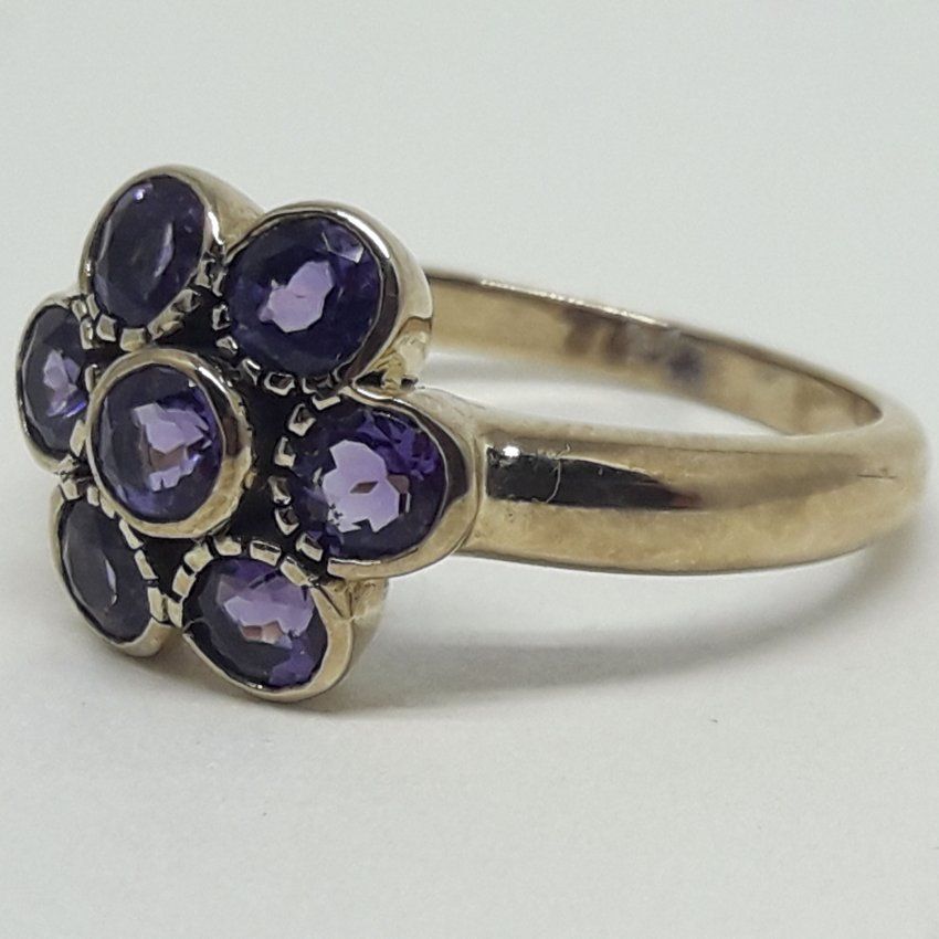 alt=\"Sortija de oro bajo 9 K. y roseta de 7 topacios azules\"