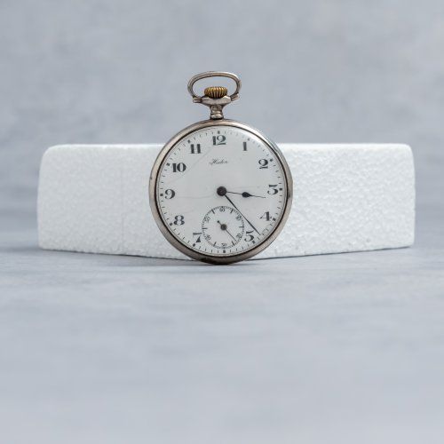 alt=\"reloj de bolsillo a cuerda antiguo de plata de ley marca Hector en estado de marcha. www.santelmotienda.com\"