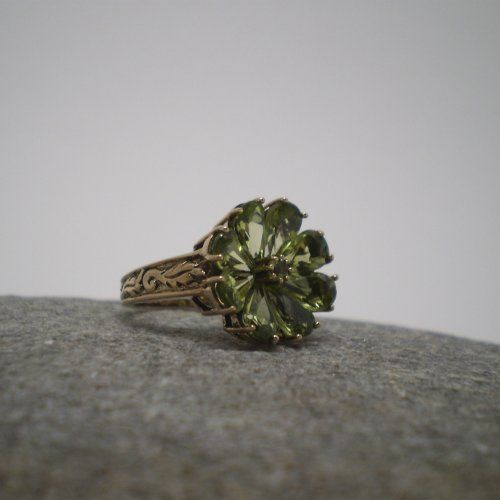 alt=\"Sortija oro olivinas flor\"
